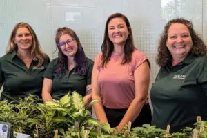 Team Members of Oakland Green Interiors with Indoor Plants in Columbus, OH