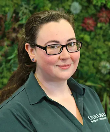 Alison Rifenburgh, horticultural technician, smiling at Oakland Green Interiors