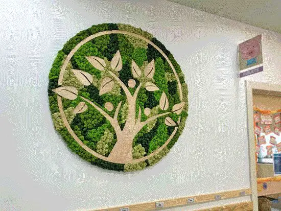 Artistic moss circle design mounted on a modern wall in Columbus, OH