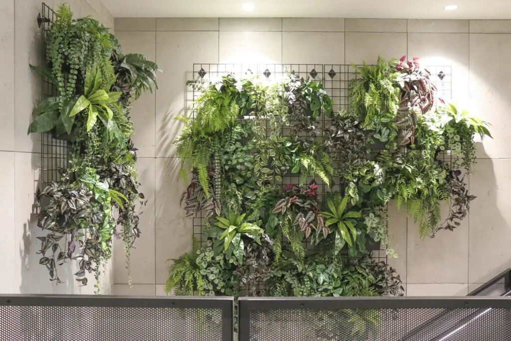 faux plant wall along staircase