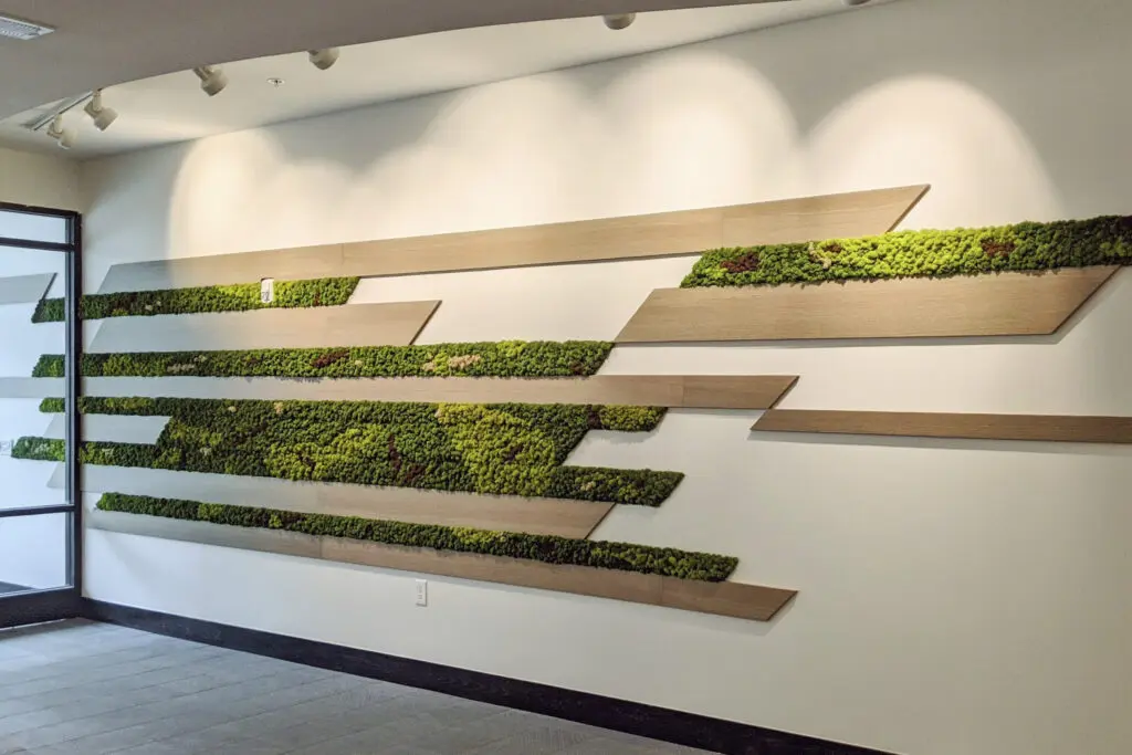 Moss and wood panels in an entryway space