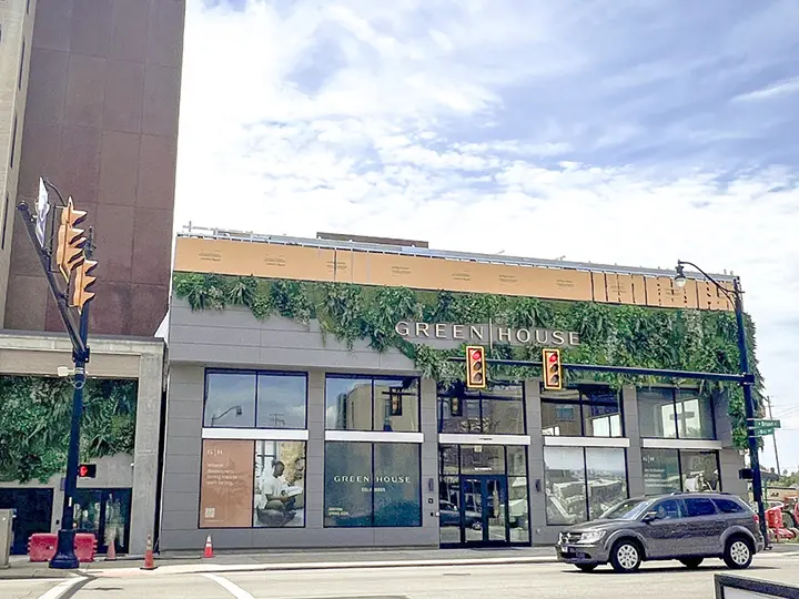 Exterior faux plant wall at GreenHouse Columbus, by Oakland Green Interiors.