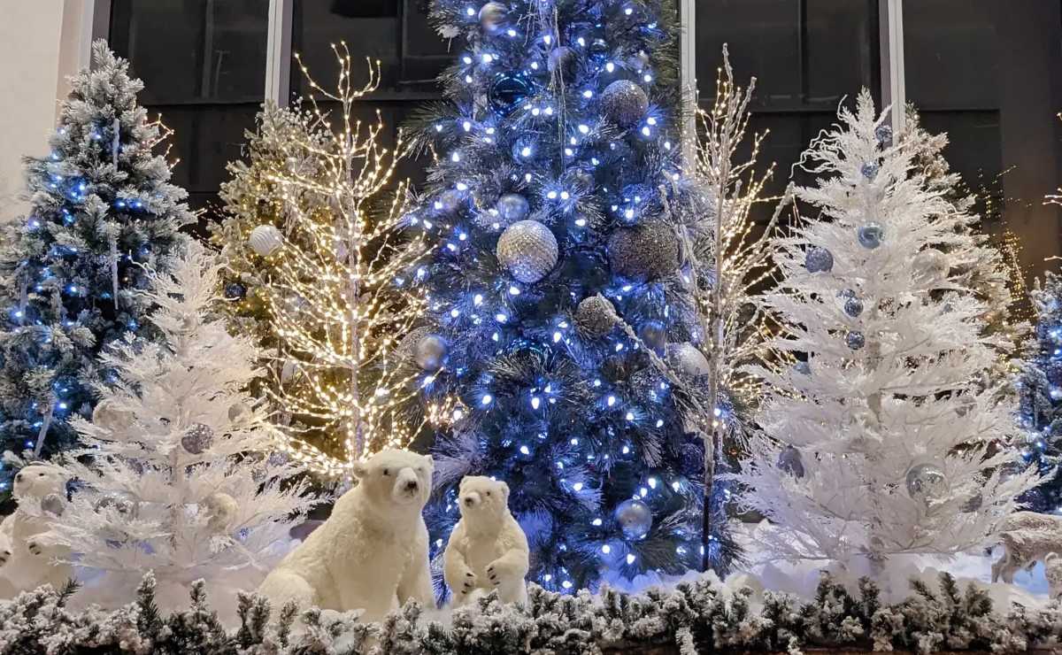 Polar bear statue with Christmas decorations.
