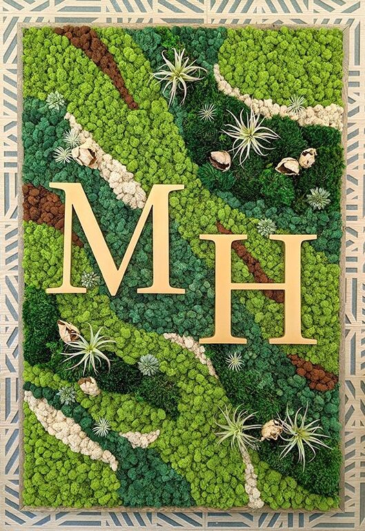 Vertical moss wall with logo design